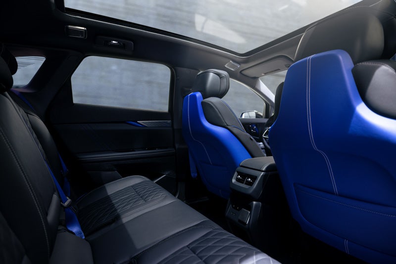 Back Seat View of the 2026 OPTIQ-V Blue Front Seats, Sun Roof, and Interior | Cole Valley Cadillac in Warren OH